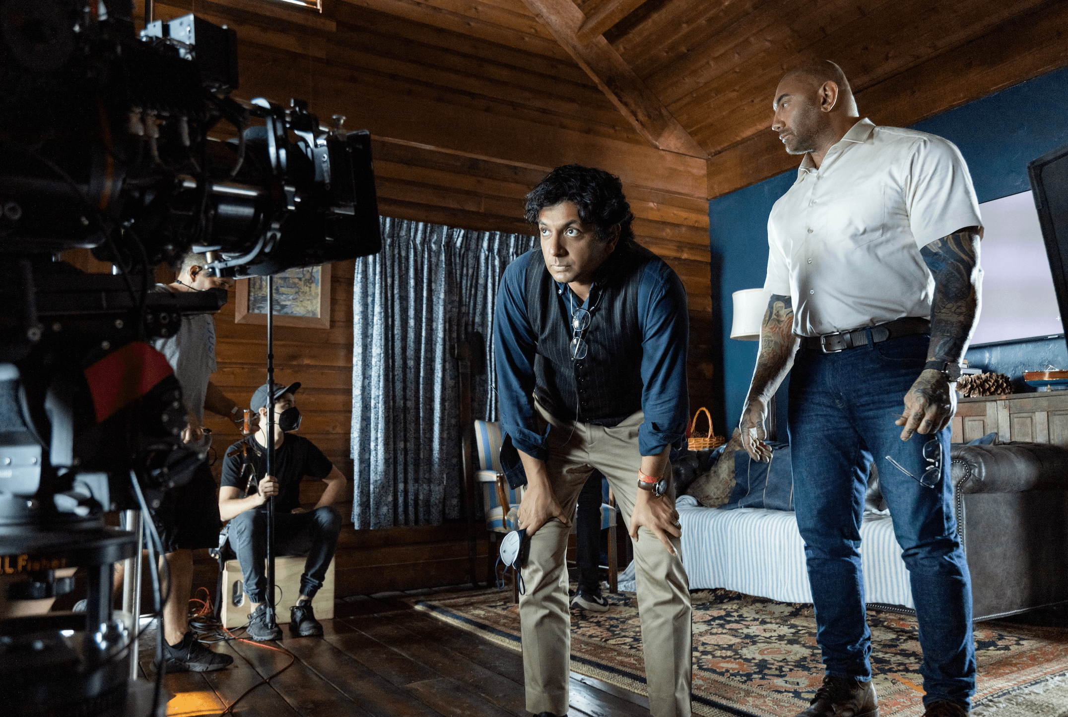 Dave Batista with M. Night Shyamalan.  Photo credit: Universal 'Knock At The Cabin'